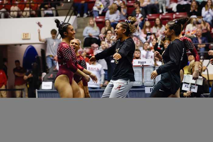 Luisa Blanco celebrates on floor against Missouri